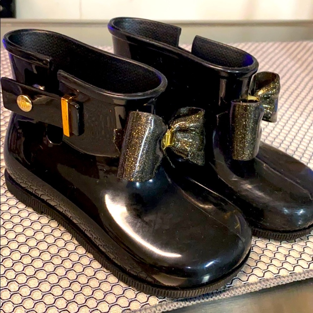 Used Mini Melissa boots.